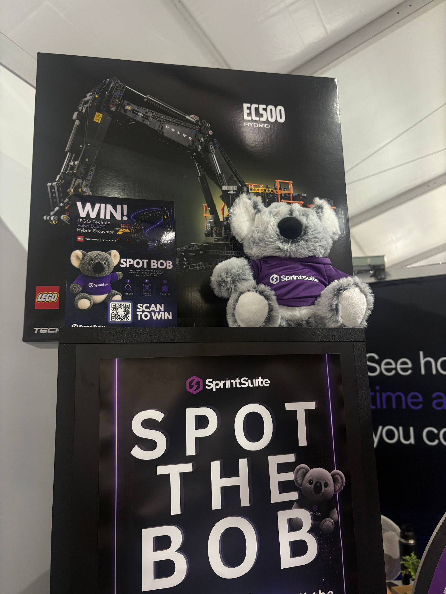Bob the koala with the LEGO Technic Volvo EC500 major prize at SprintSuite Stand C604