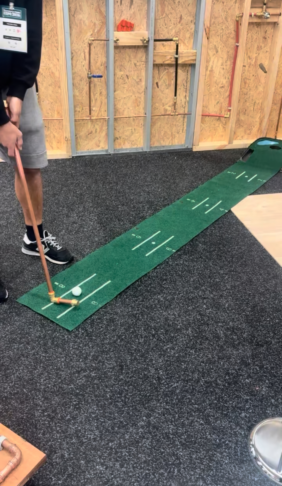 Copper pipe putter mini-golf activation at a plumbing supplier stand, Bunnings Trade Expo Melbourne