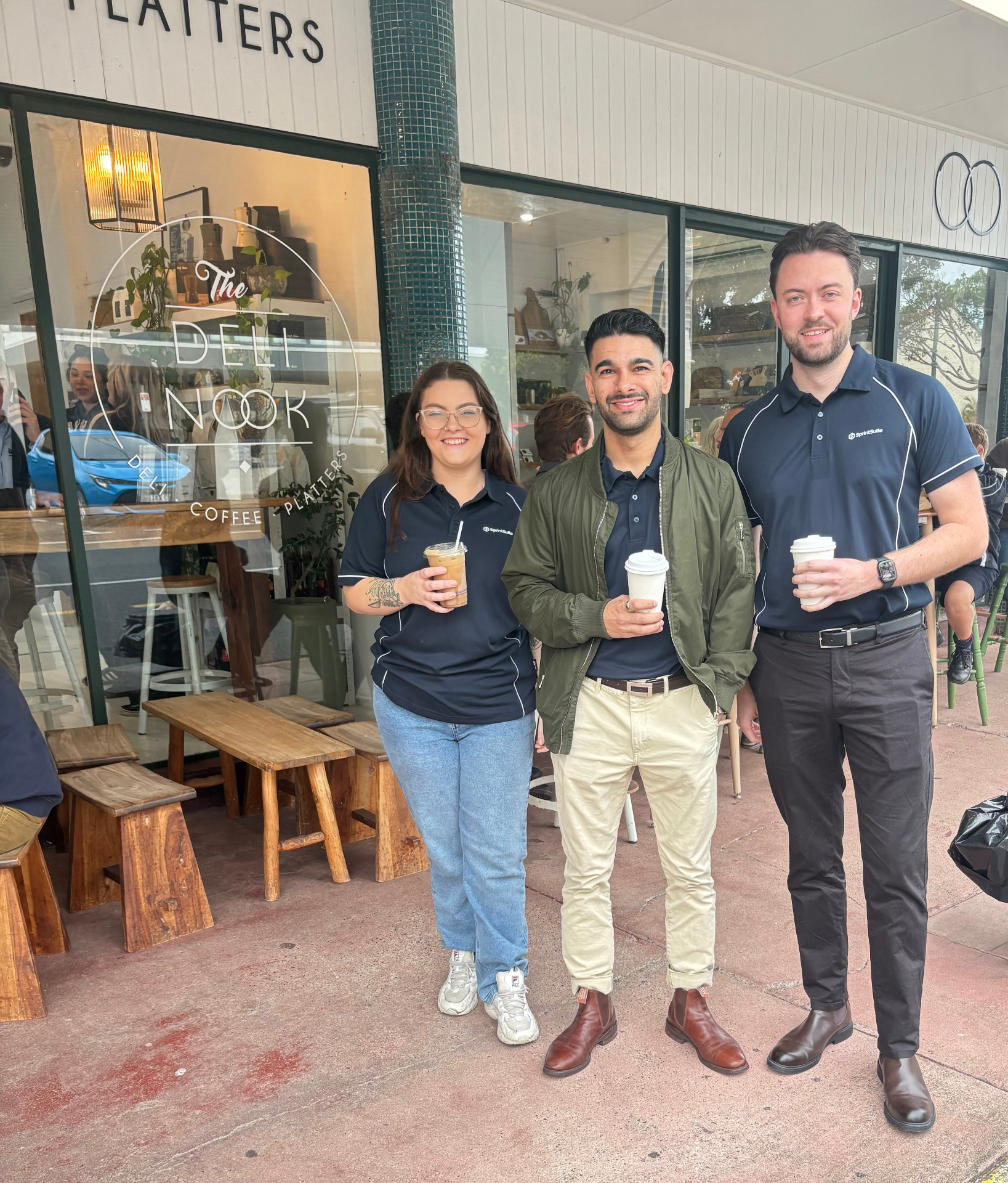 SprintSuite team outside The Deli Nook Mackay with free coffees for QME delegates